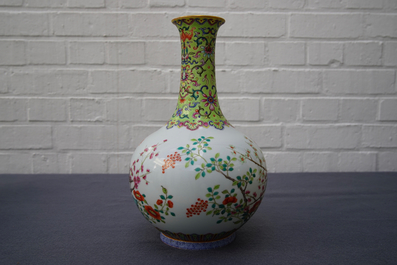 A Chinese famille rose bottle vase with floral design, Jiaqing mark, 19/20th C.